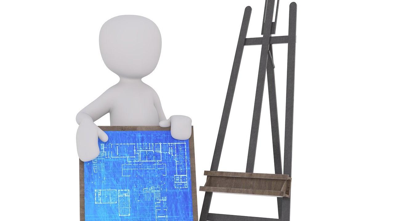A 3D model of a person holding a architectural blueprint next to an upright easel. Image by Peggy and Marco Lachmann-Anke from Pixabay.